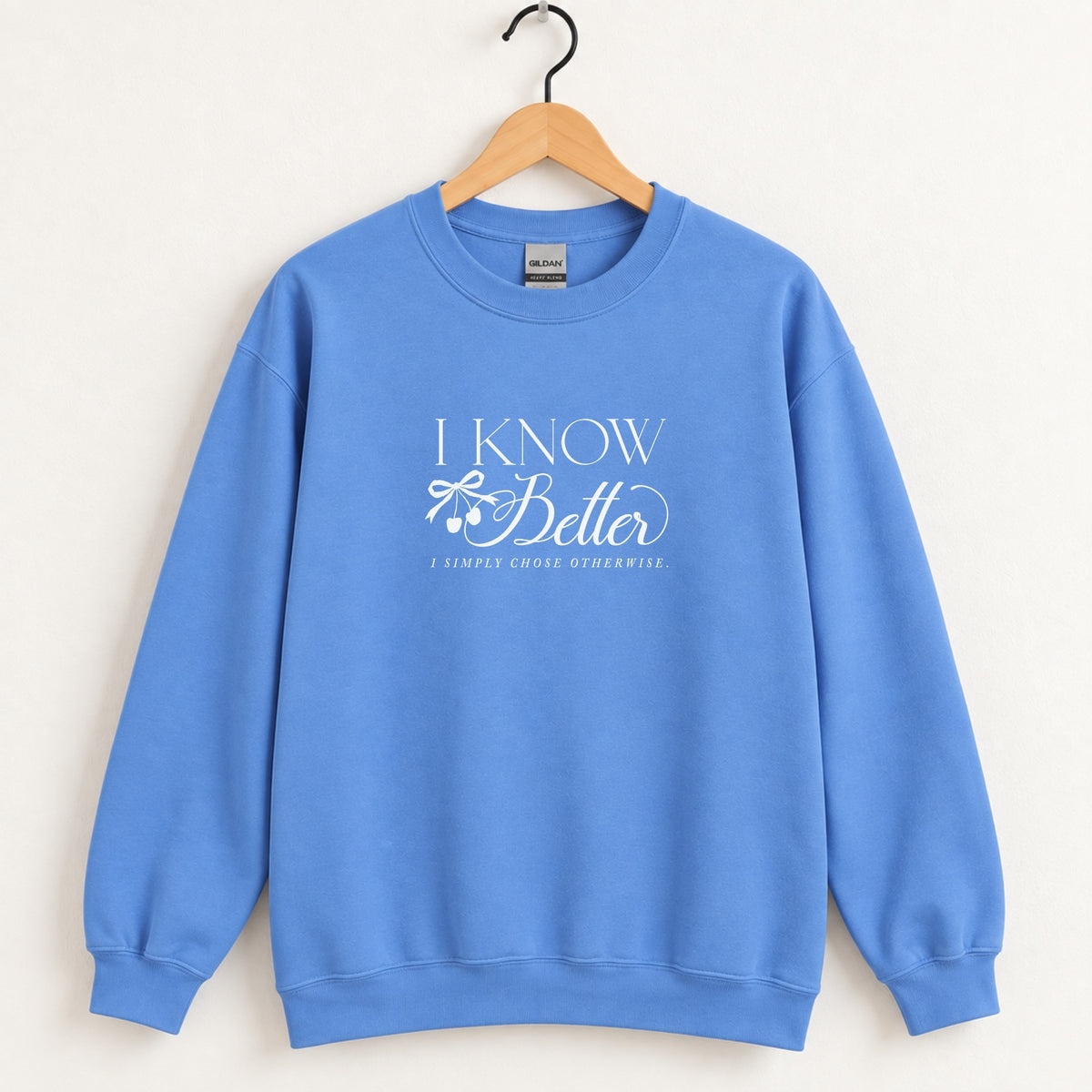I Know Better, I Simply Chose Otherwise crewneck sweatshirt in Carolina Blue on a wooden hanger