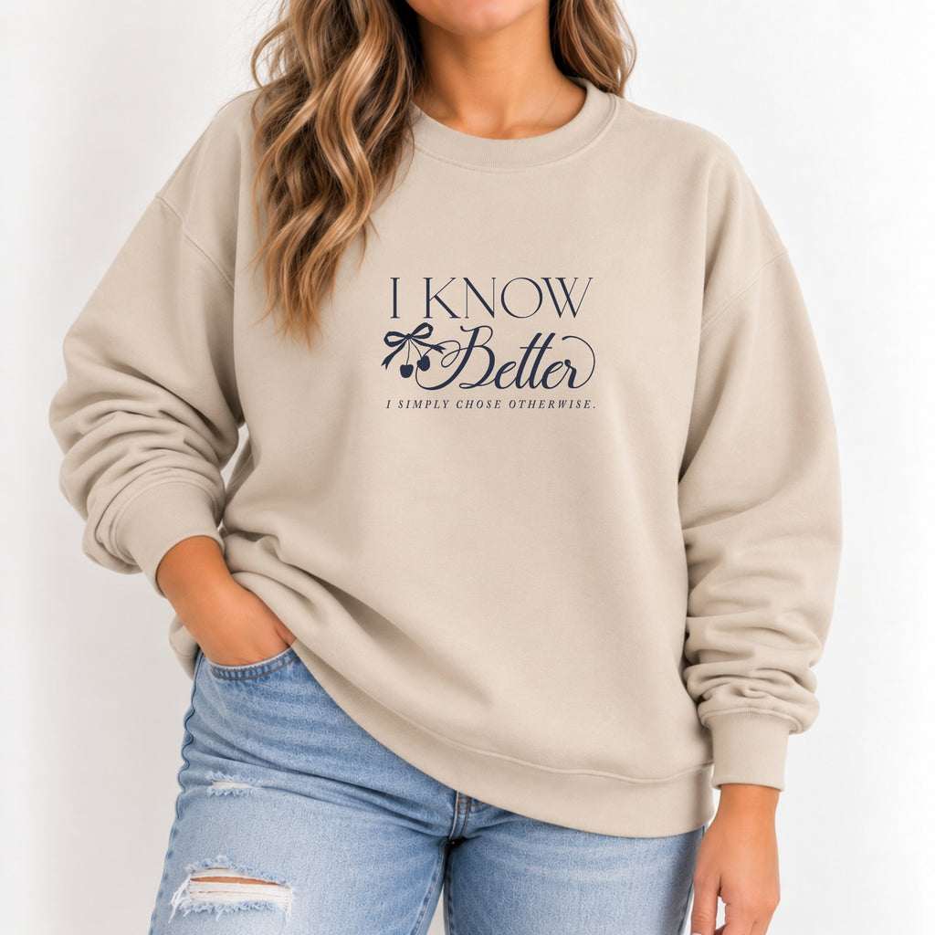 Woman wearing the I Know Better, I Simply Chose Otherwise crewneck in Sand with a navy chest print