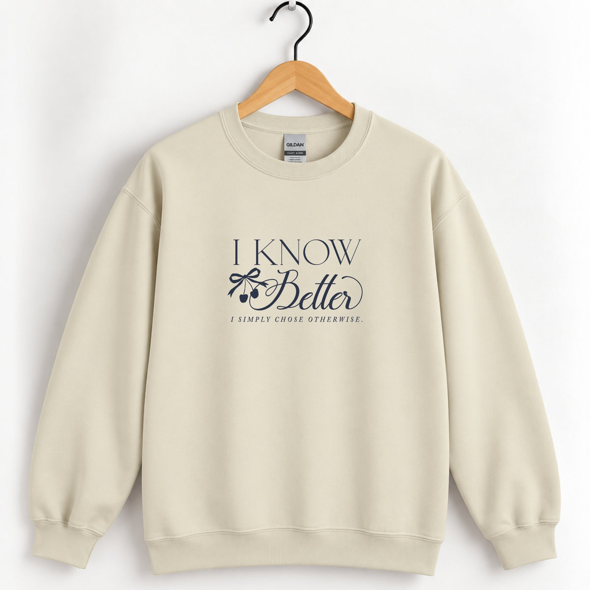 I Know Better, I Simply Chose Otherwise crewneck sweatshirt in Sand on a wooden hanger, navy chest print