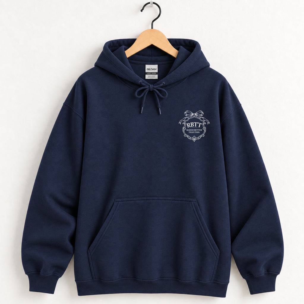 Raised Better Than This crest hoodie in Navy on a wooden hanger, white left-chest crest