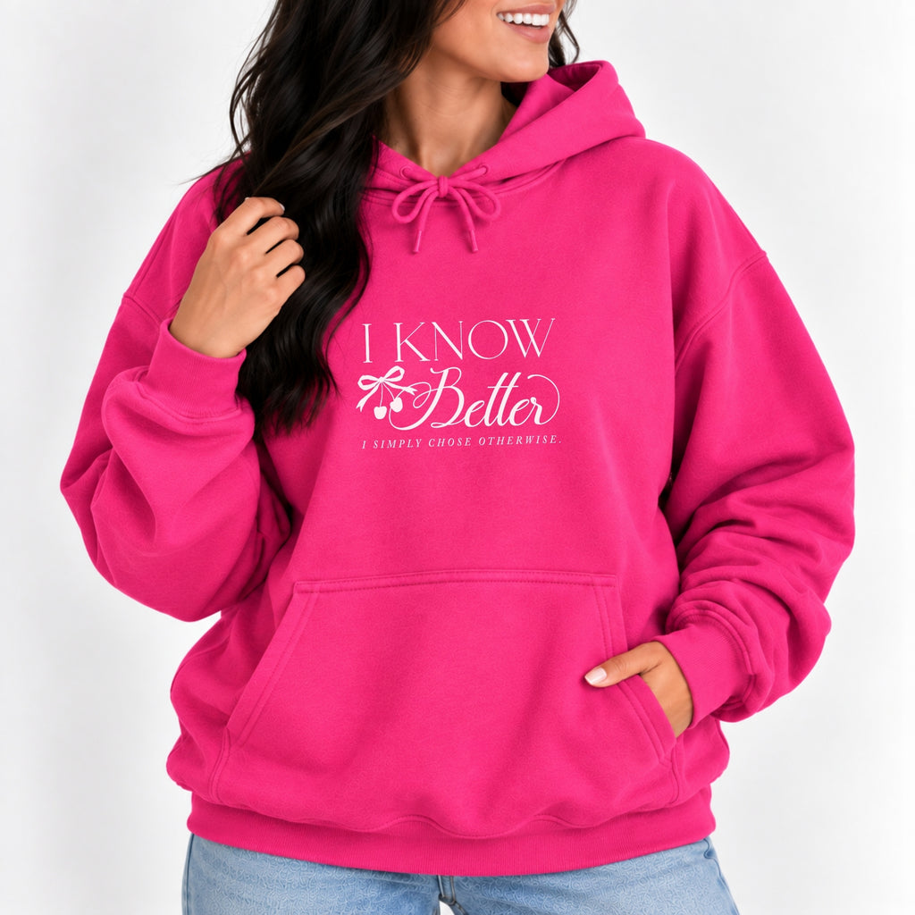 Woman wearing the I Know Better, I Simply Chose Otherwise hoodie in Heliconia pink