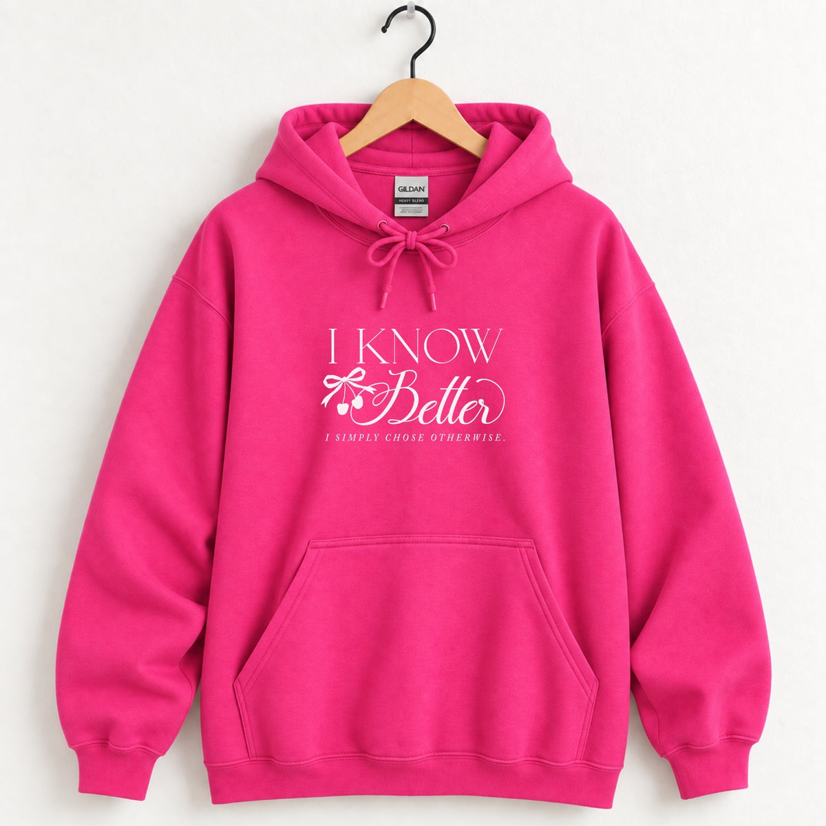 I Know Better, I Simply Chose Otherwise hoodie in Heliconia pink on a wooden hanger