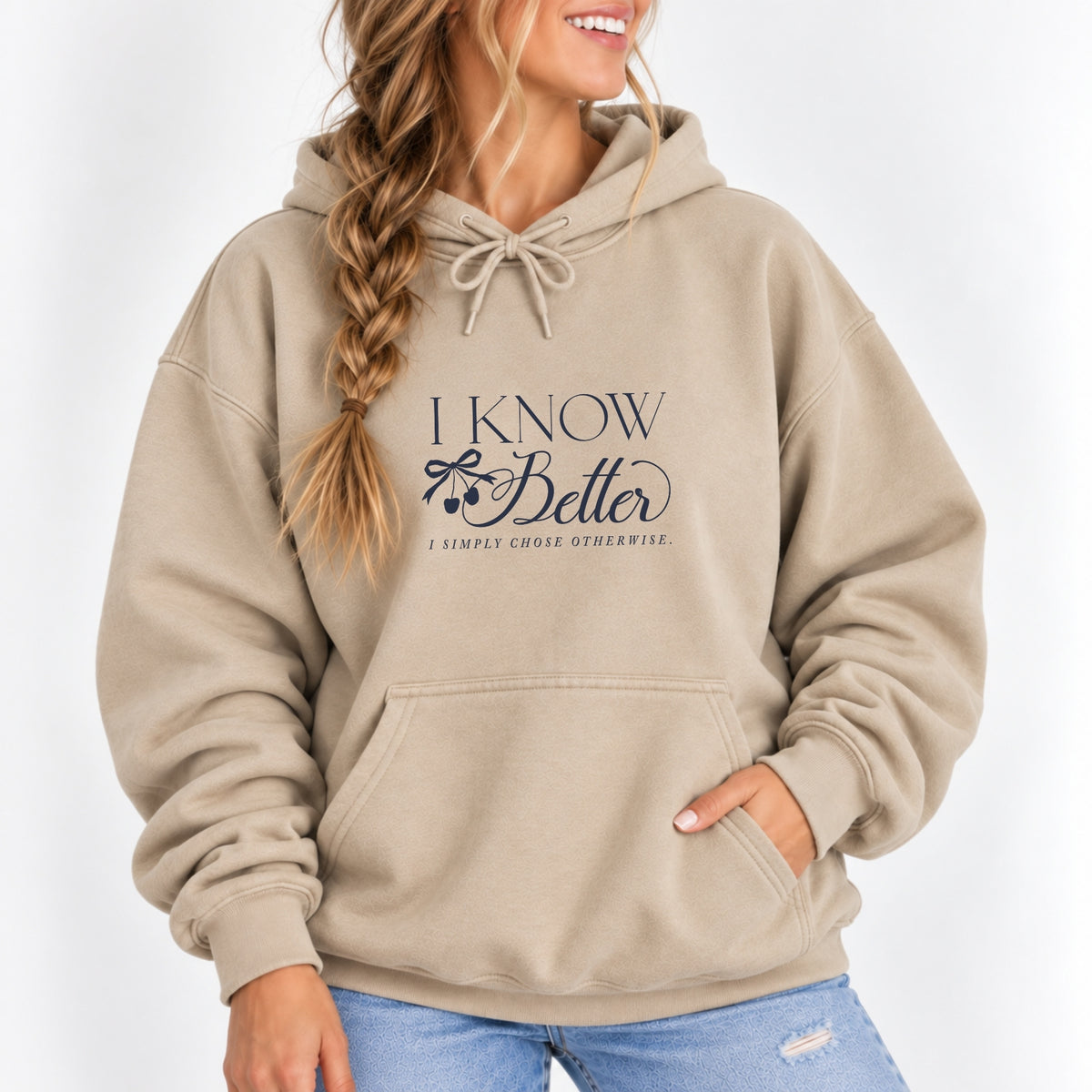Woman wearing the I Know Better, I Simply Chose Otherwise hoodie in Sand with a navy chest print