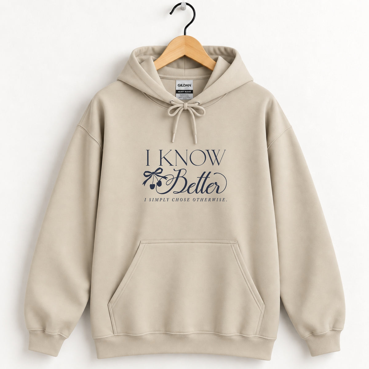 I Know Better, I Simply Chose Otherwise hoodie in Sand on a wooden hanger, navy chest print