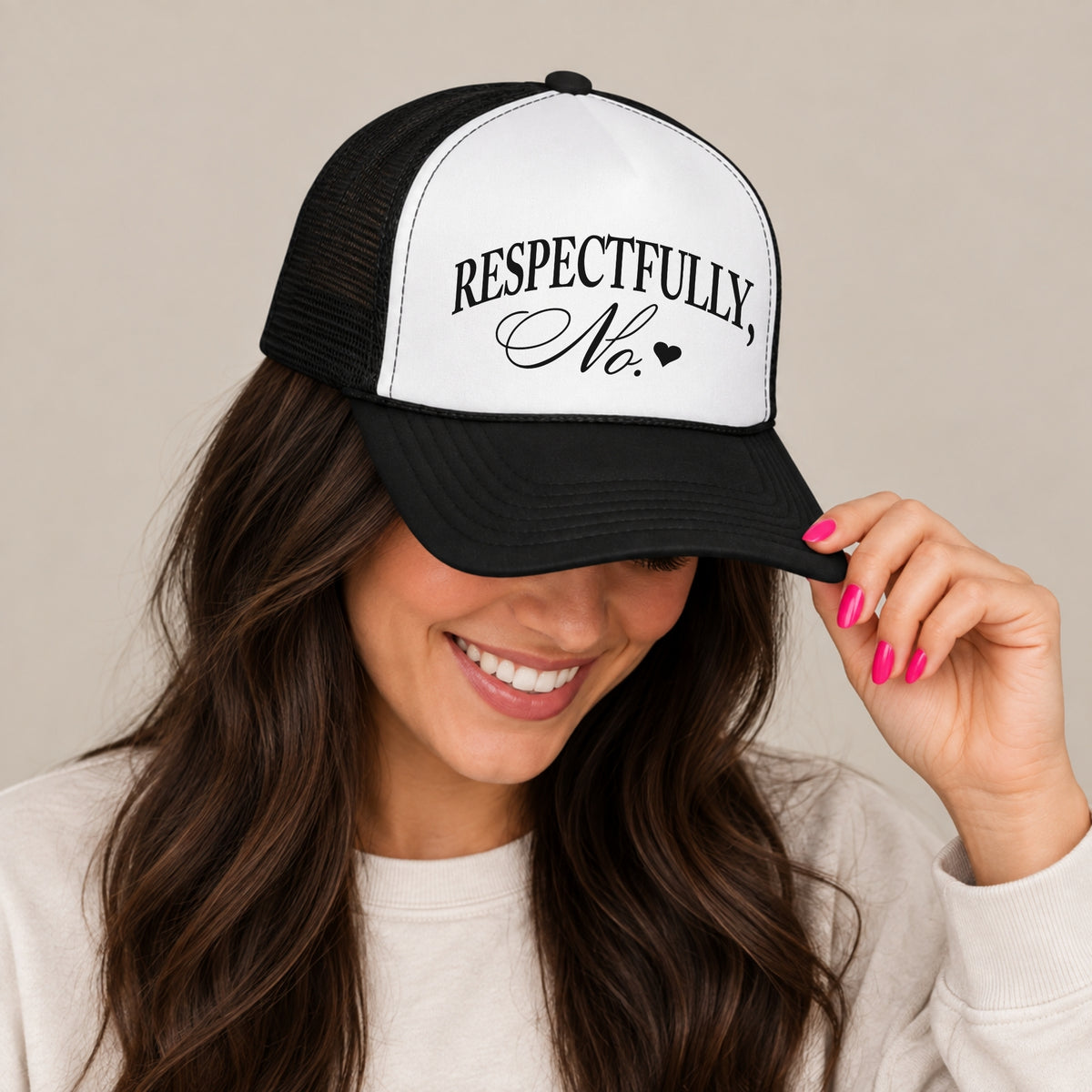 Woman in a cream sweatshirt tipping the brim of the Respectfully, No trucker hat in Black with a white front panel