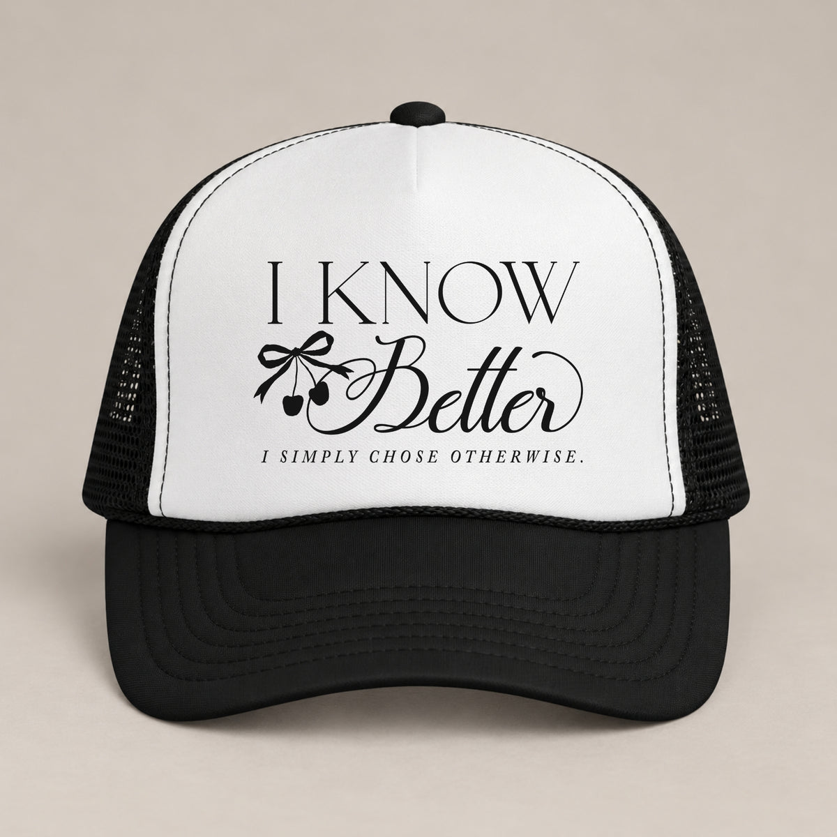 I Know Better, I Simply Chose Otherwise foam trucker hat in Black, front view, black script and cherry bow on a white panel