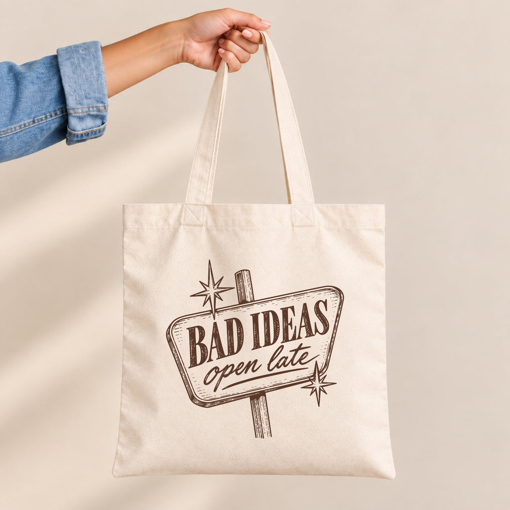 Bad Ideas, Open Late canvas tote bag held by the handles