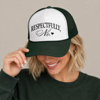 Woman in a dark green sweatshirt wearing the Respectfully, No trucker hat in Dark Green with a white front panel