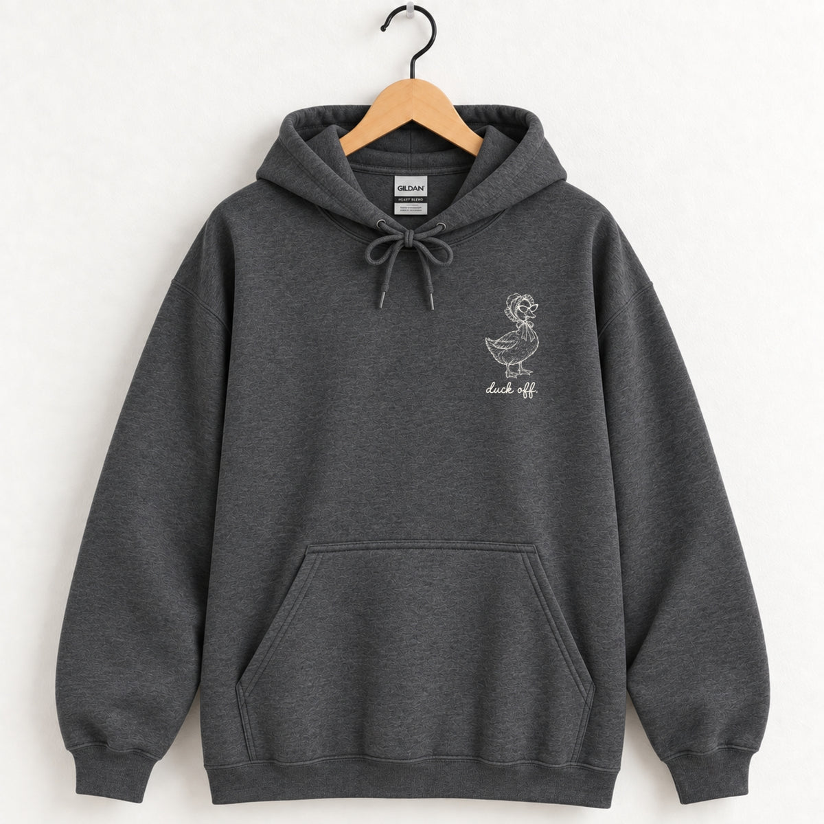 Duck Off hoodie in Dark Heather on a wooden hanger, small white duck on the left chest