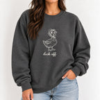 Woman wearing the Duck Off crewneck sweatshirt in Dark Heather, white duck design on the chest