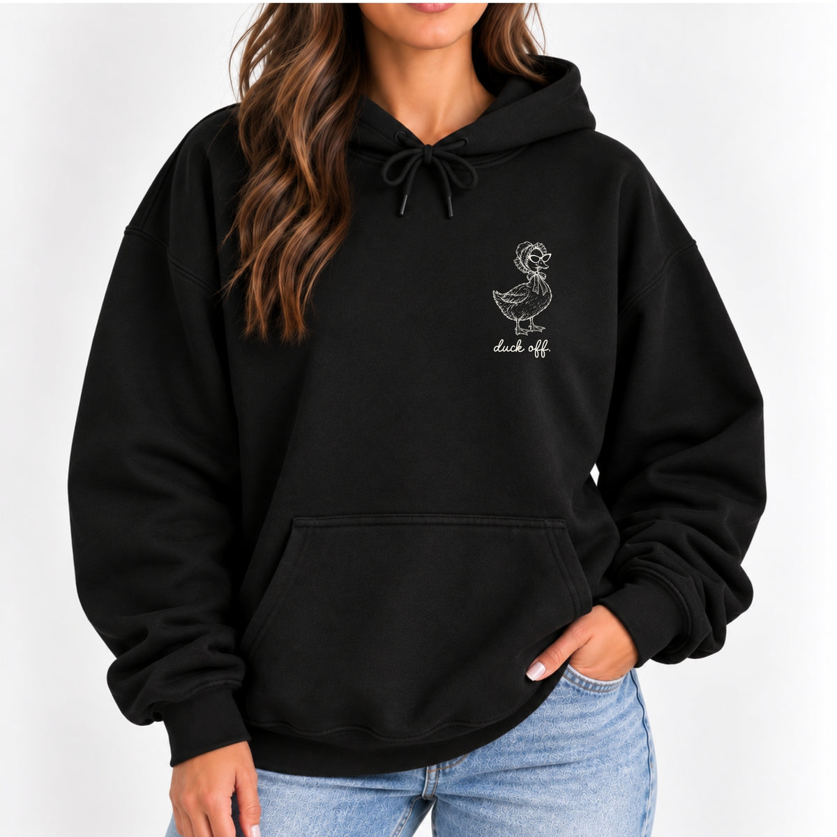 Woman wearing the Duck Off hoodie in Black, left-chest white duck design