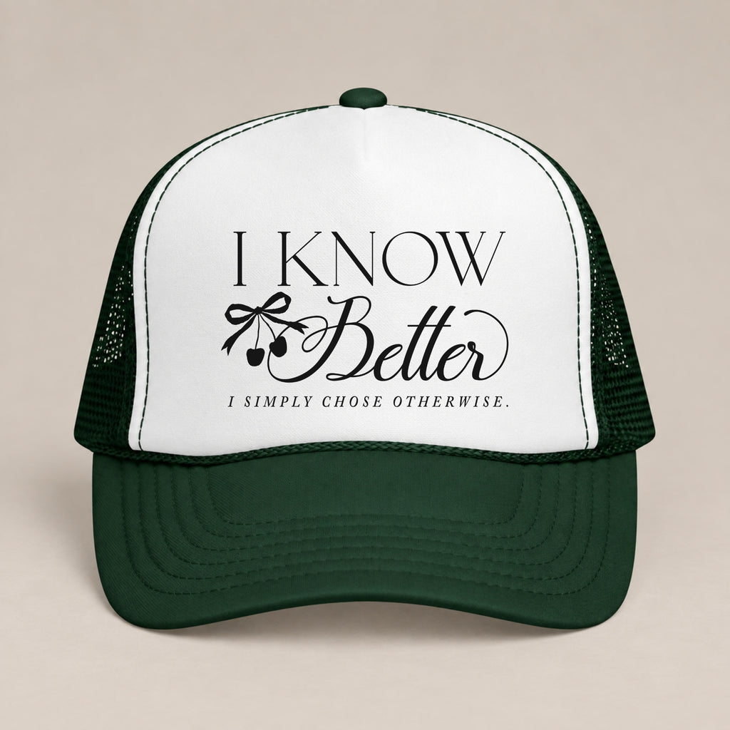 I Know Better, I Simply Chose Otherwise foam trucker hat in Dark Green, front view, black script and cherry bow on a white panel