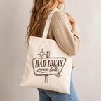 Woman carrying the Bad Ideas, Open Late canvas tote on her shoulder