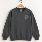 Raised Better Than This crest crewneck sweatshirt in Dark Heather on a wooden hanger