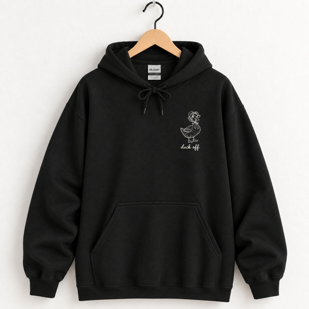 Duck Off hoodie in Black on a wooden hanger, small white duck on the left chest