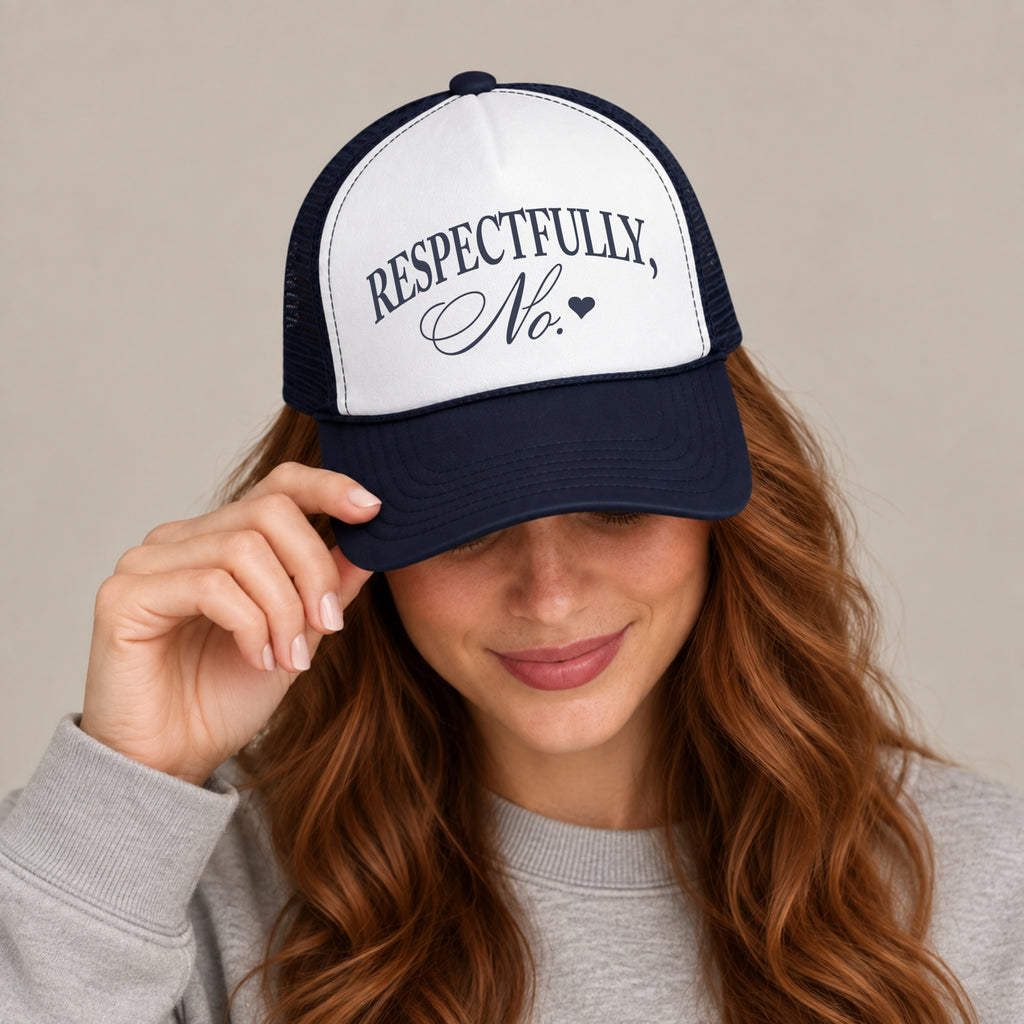 Woman in a grey sweatshirt wearing the Respectfully, No trucker hat in Navy with a white front panel