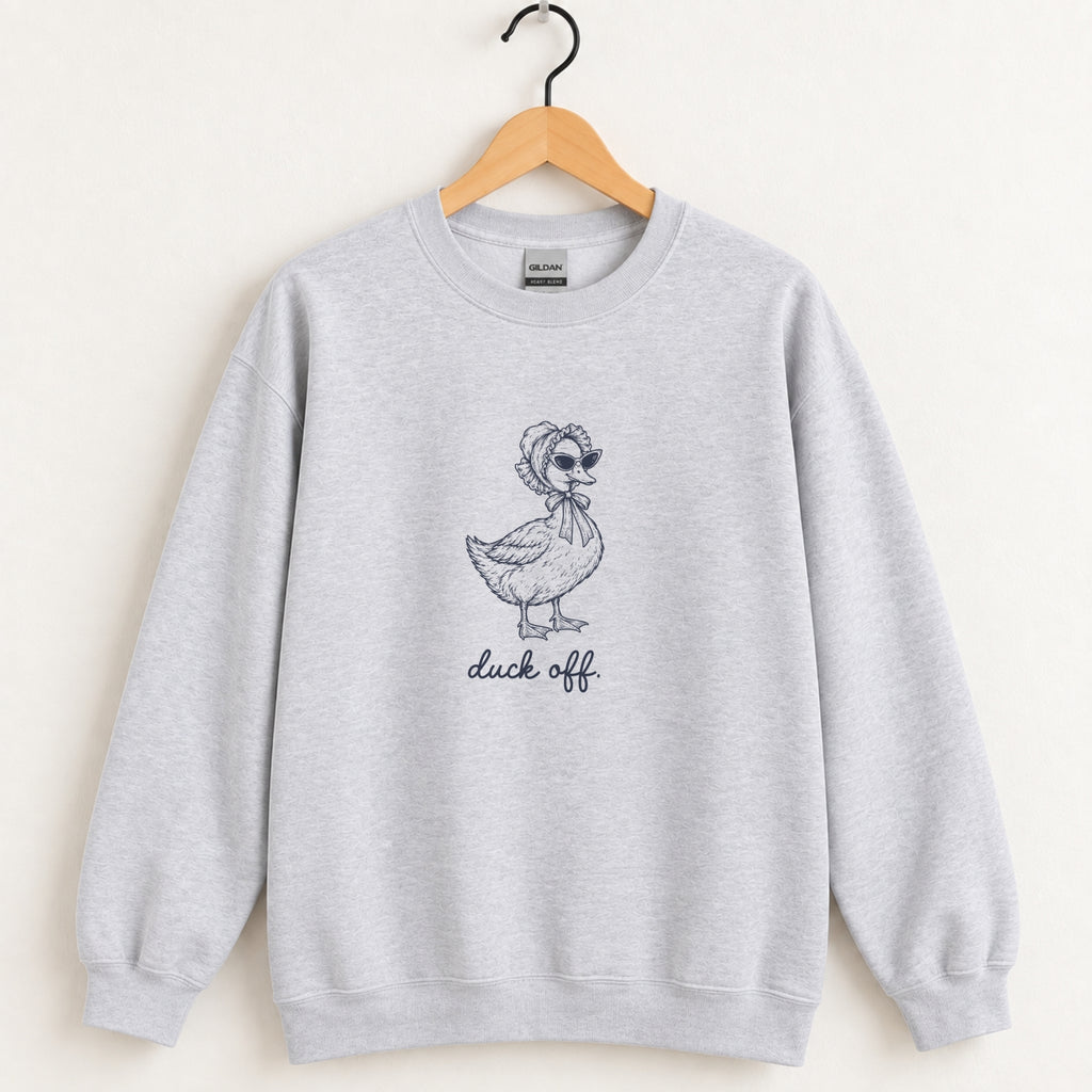 Duck Off crewneck sweatshirt in Ash on a wooden hanger, navy duck design center chest