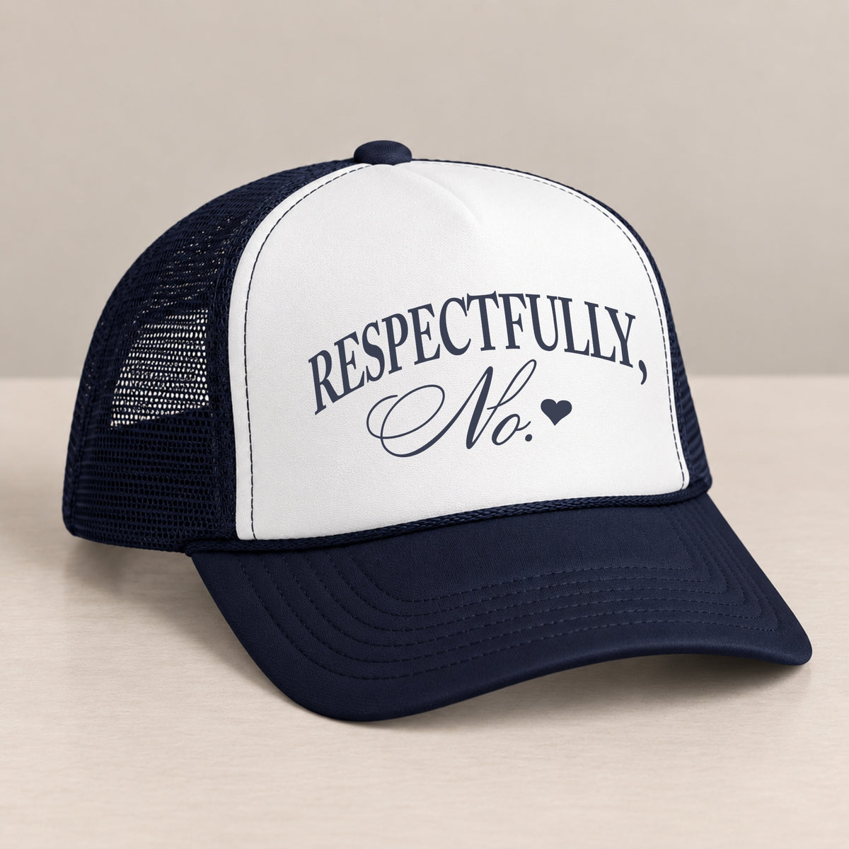 Respectfully, No trucker hat in Navy on a table, angled view showing the mesh back and curved bill