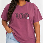 Woman with braids wearing the Boo embroidered tee in Berry with jeans