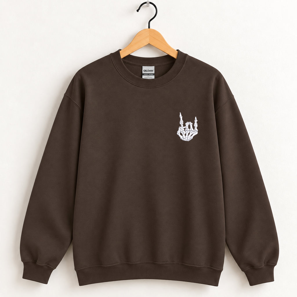 Rock On Skeleton Hand embroidered crewneck sweatshirt in Dark Chocolate on a wooden hanger
