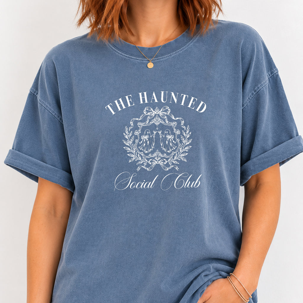 Woman wearing The Haunted Social Club crest tee in Blue Jean