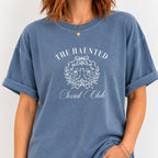 Woman wearing The Haunted Social Club crest tee in Blue Jean
