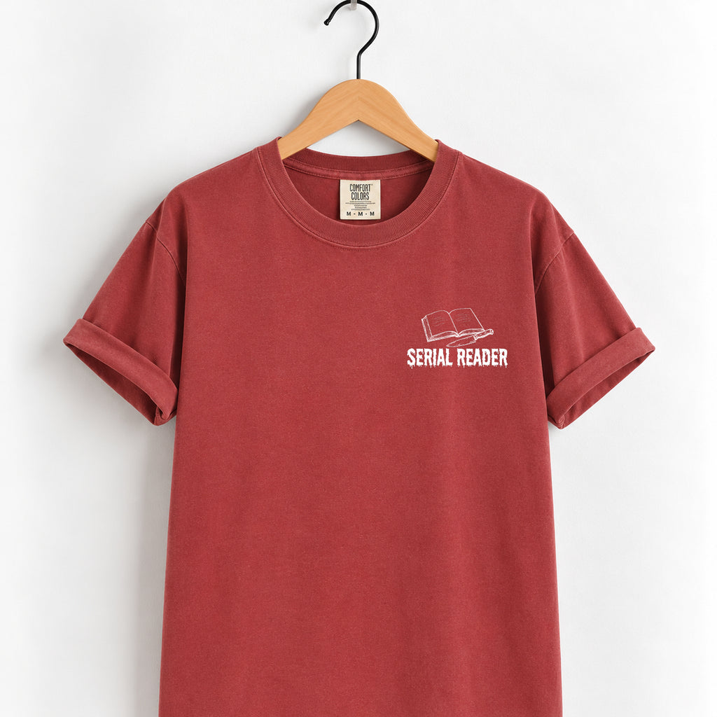 Serial Reader tee in Chili on a wooden hanger