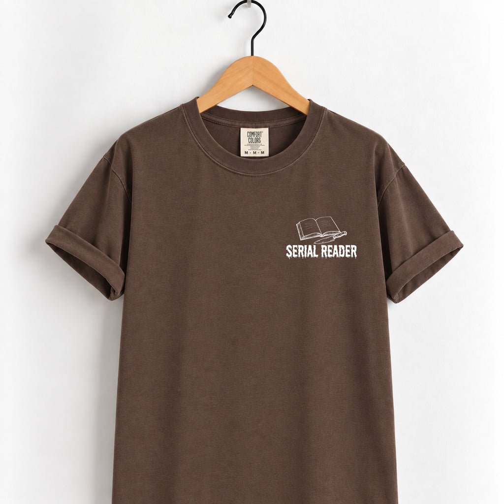 Serial Reader tee in Espresso on a wooden hanger