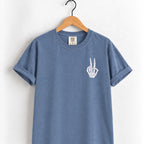 Peace sign skeleton hand embroidered tee in Blue Jean on a wooden hanger