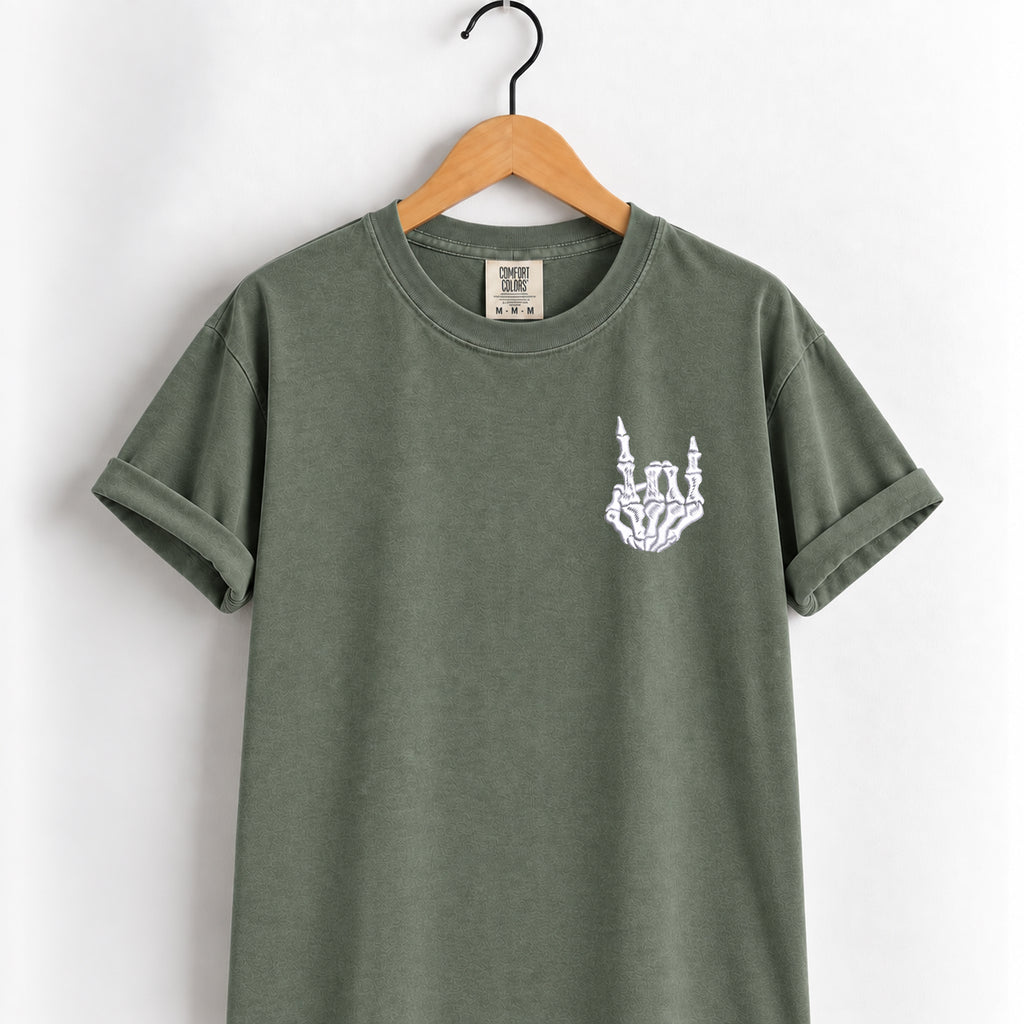 Rock on skeleton hand embroidered tee in Moss on a wooden hanger
