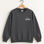 Serial Reader crewneck sweatshirt in Dark Heather on a wooden hanger