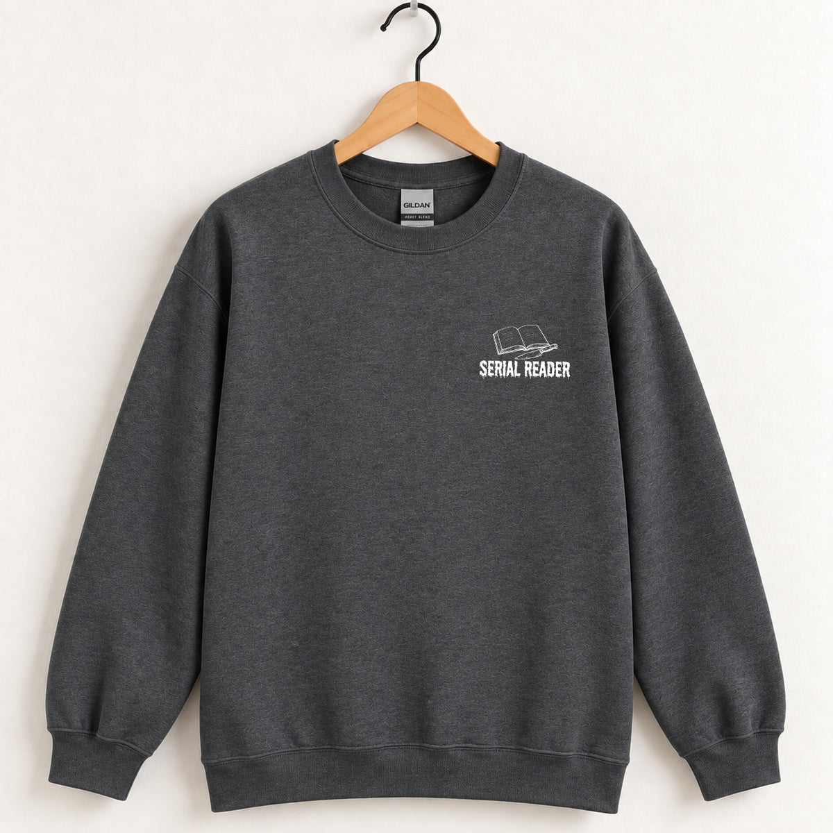 Serial Reader crewneck sweatshirt in Dark Heather on a wooden hanger