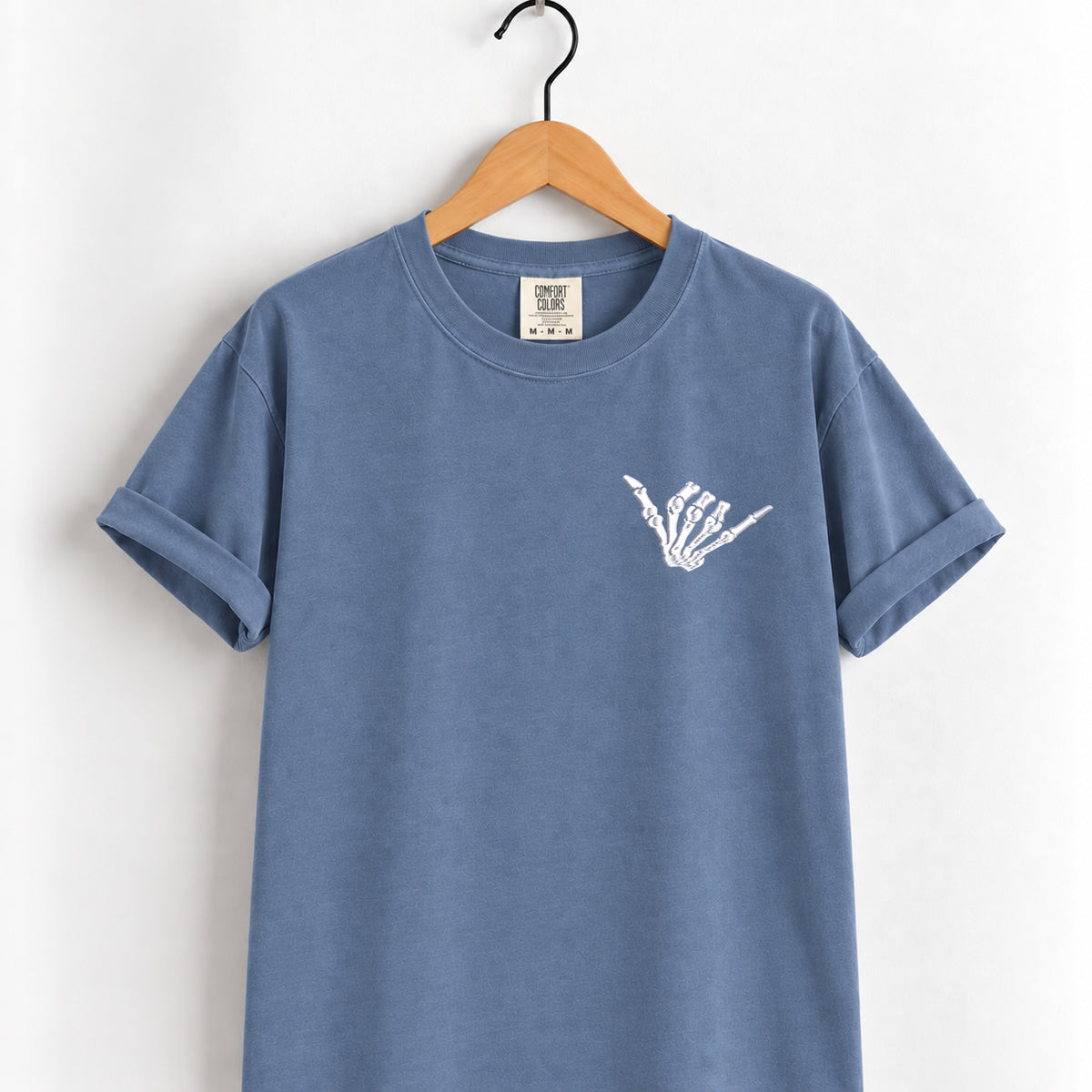 Shaka skeleton hand embroidered tee in Blue Jean on a wooden hanger