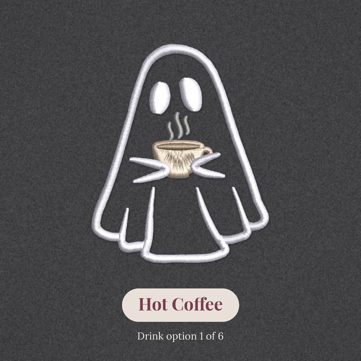 Close-up of the embroidered ghost holding a hot coffee, drink option 1 of 6