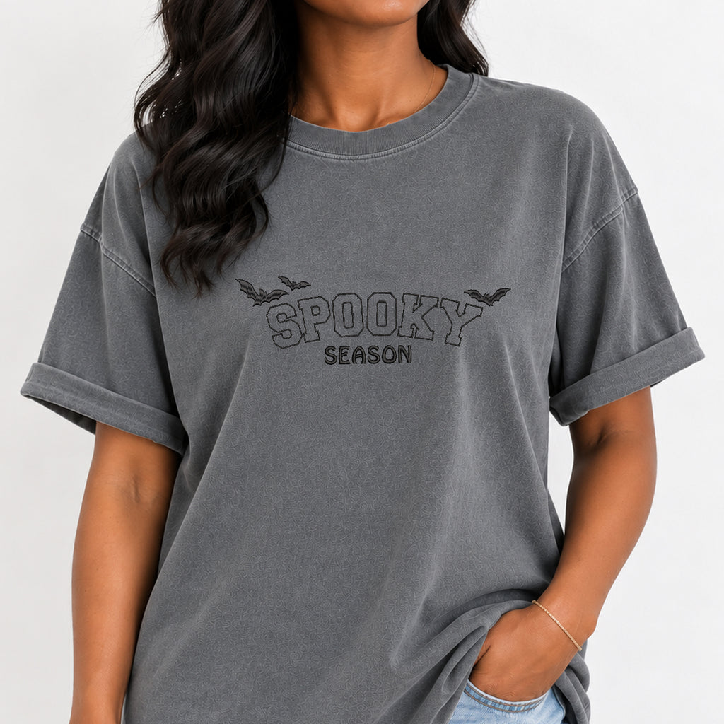Woman wearing the Spooky Season embroidered bats tee in Grey