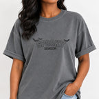 Woman wearing the Spooky Season embroidered bats tee in Grey