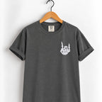 Rock on skeleton hand embroidered tee in Pepper on a wooden hanger, white thread left chest