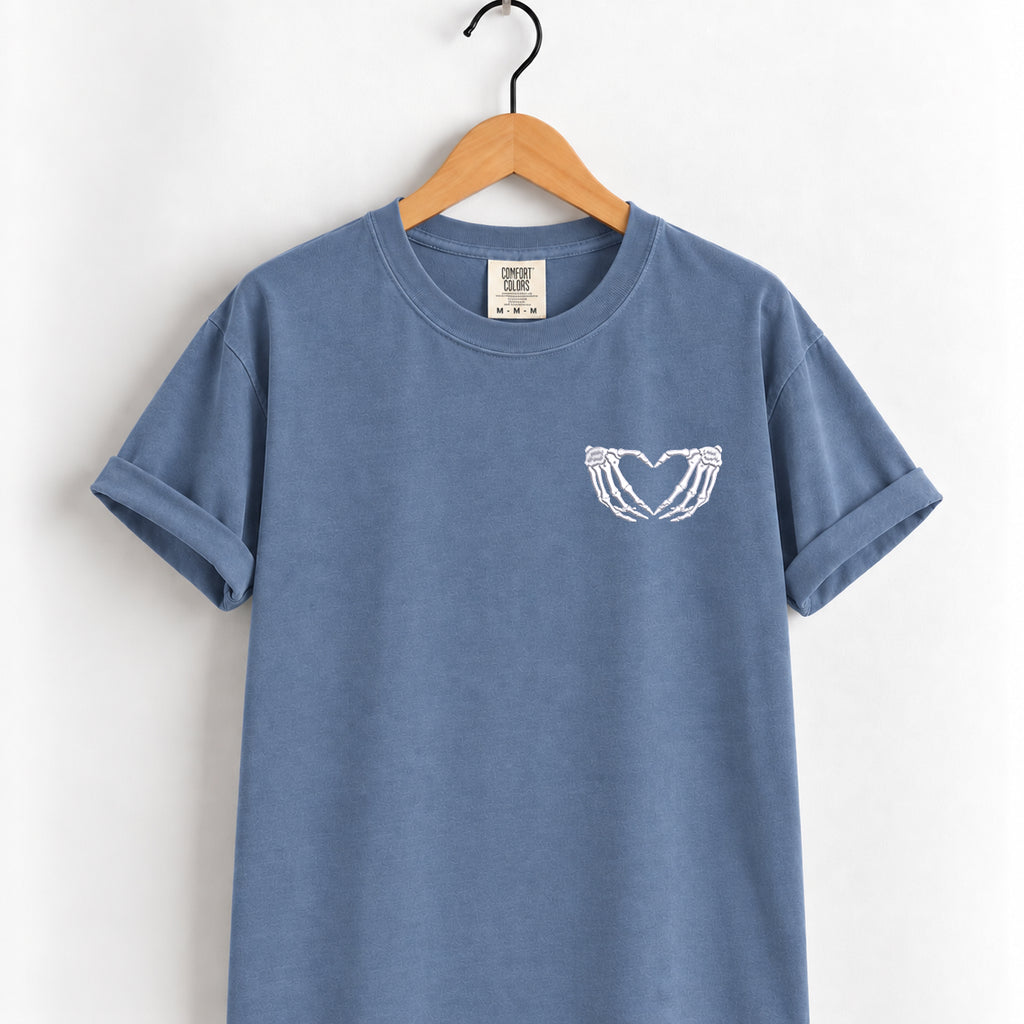 Heart hands skeleton embroidered tee in Blue Jean on a wooden hanger