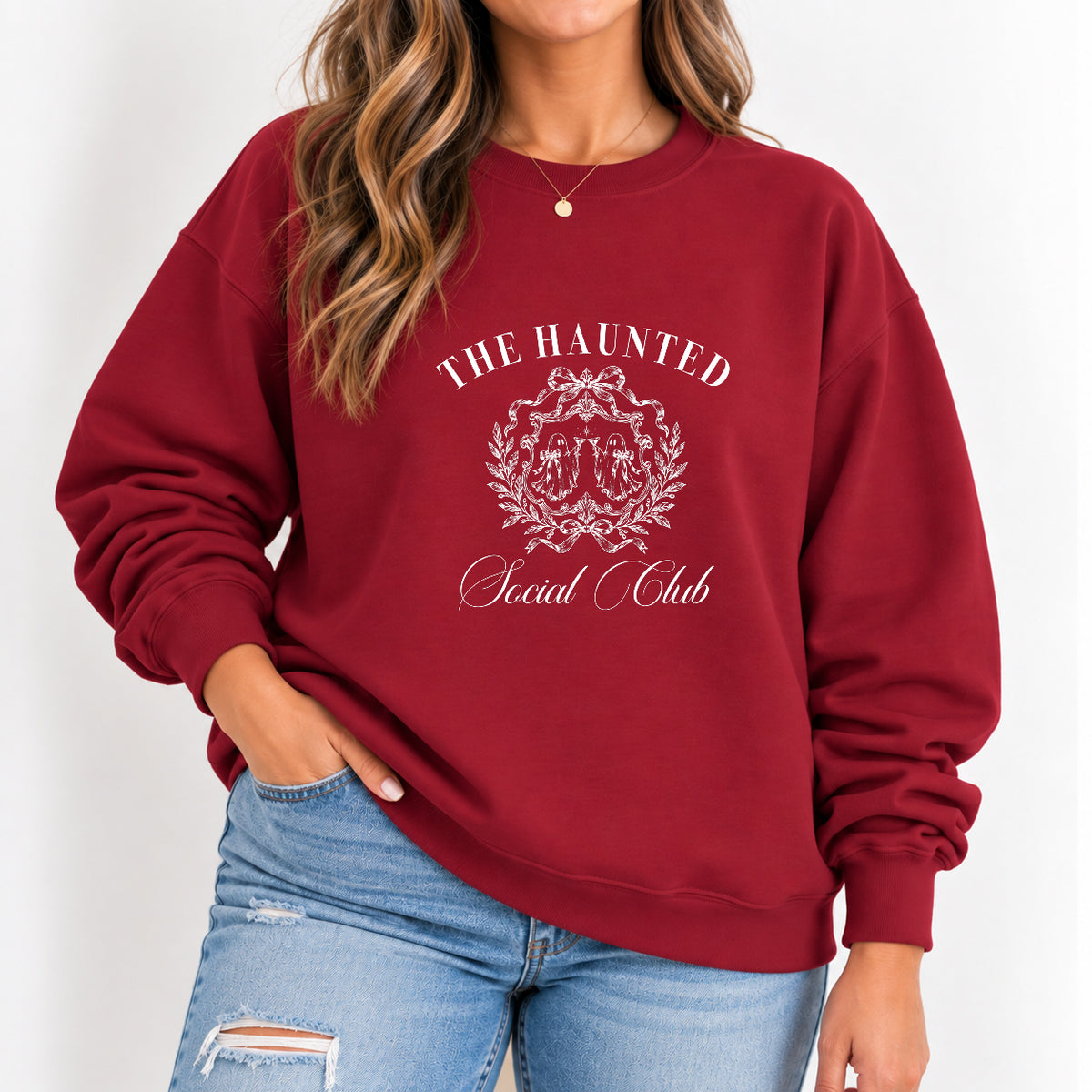 Woman wearing The Haunted Social Club crewneck sweatshirt in Cardinal Red with jeans
