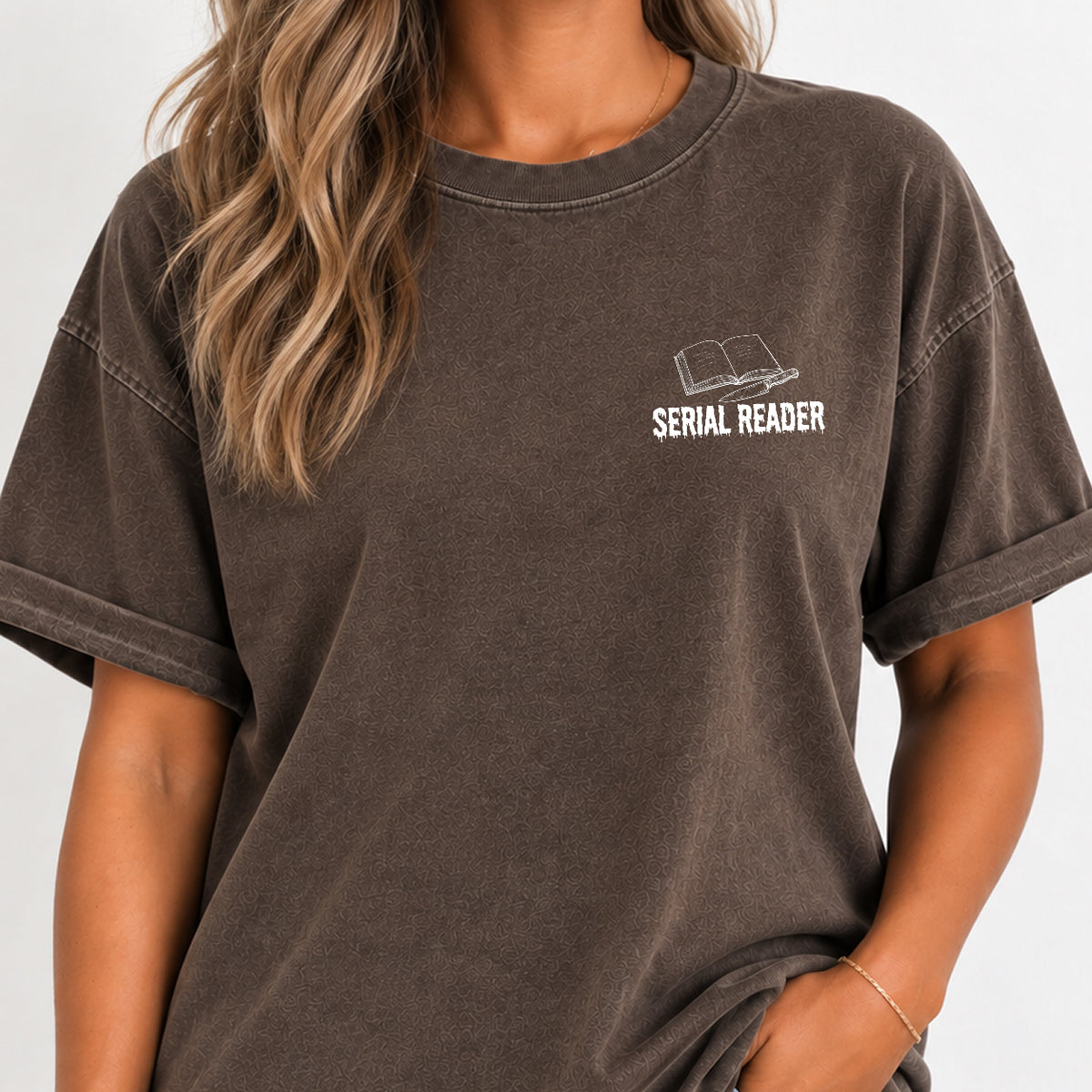 Woman wearing the Serial Reader left chest book tee in Espresso
