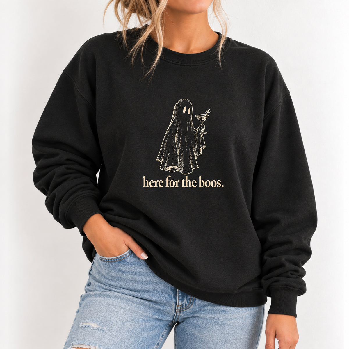 Woman wearing the Here for the Boos crewneck sweatshirt in Black with jeans