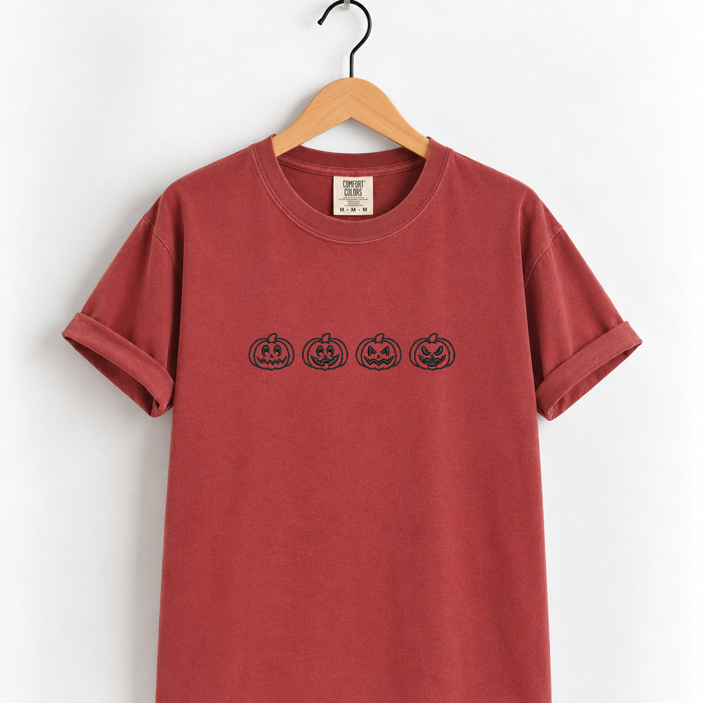 Jack-o-lantern embroidered tee in Chili on a wooden hanger
