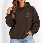 Woman wearing the Here for the Boos hoodie in Dark Chocolate with jeans