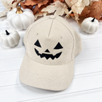 Jack-o-lantern embroidered corduroy snapback hat in Ivory with a black thread pumpkin face