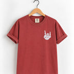 Rock on skeleton hand embroidered tee in Chili on a wooden hanger
