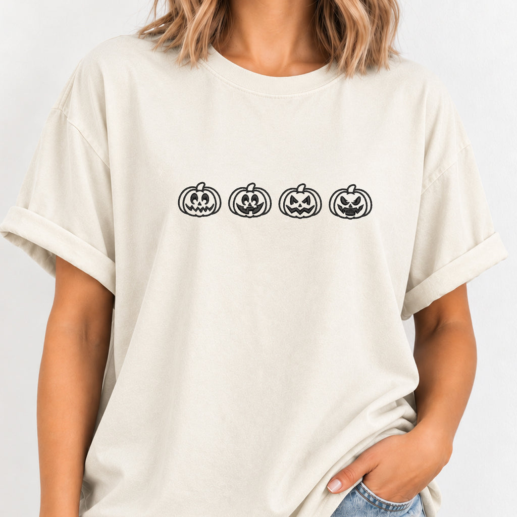 Woman wearing the jack-o-lantern embroidered tee in Ivory