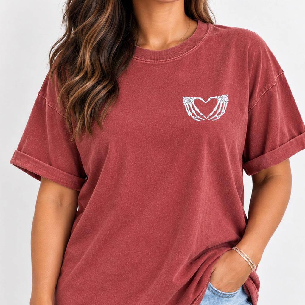 Woman wearing the heart hands skeleton embroidered tee in Chili