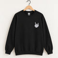 Rock On Skeleton Hand embroidered crewneck sweatshirt in Black on a wooden hanger, white thread rock-on skeleton hand on the left chest