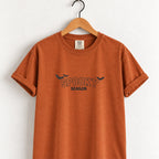 Spooky Season embroidered tee in Yam on a wooden hanger