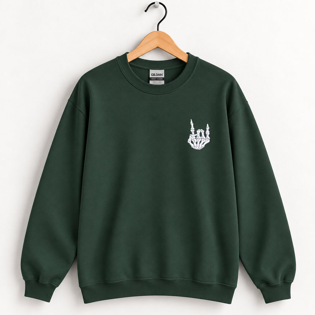 Rock On Skeleton Hand embroidered crewneck sweatshirt in Forest Green on a wooden hanger